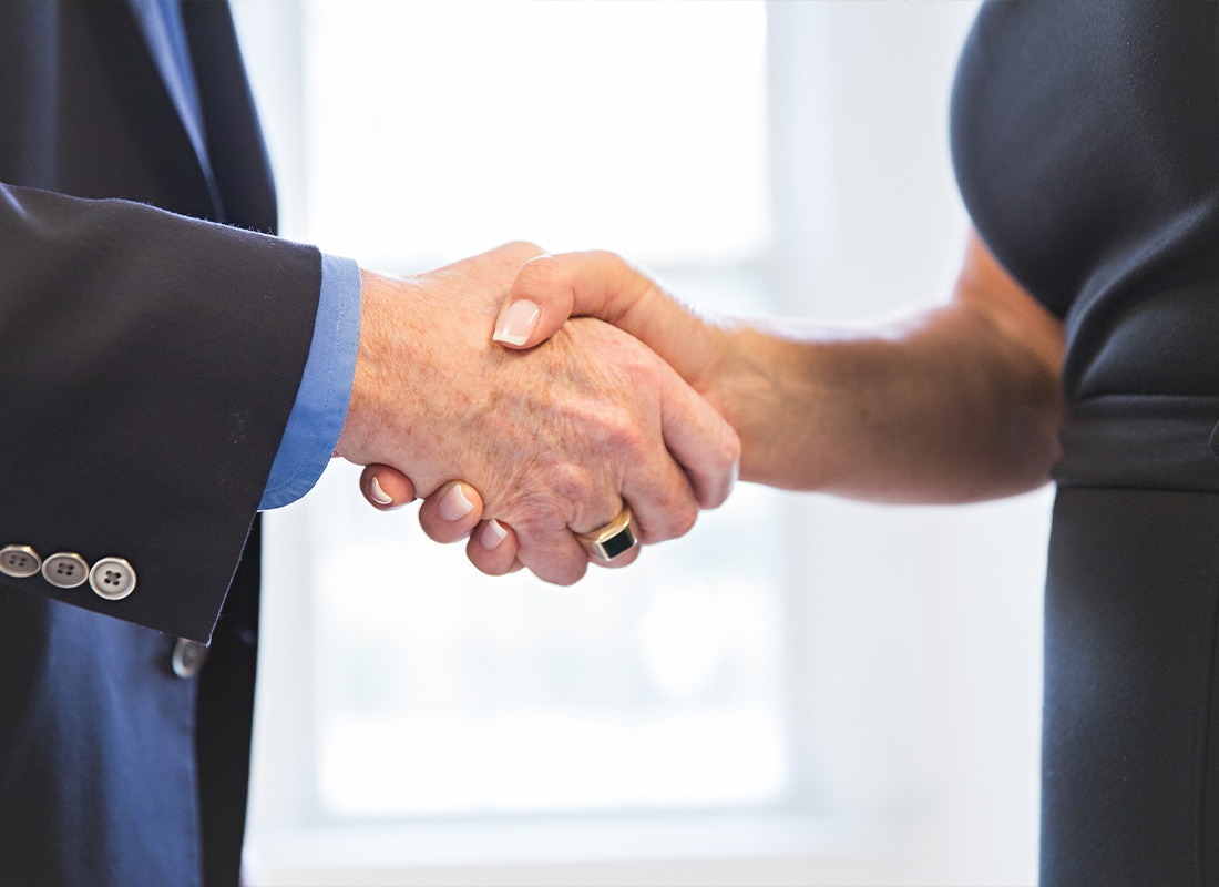 We Are Independent - Two People Shaking Hands After a Successful Meeting